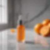 A vibrant bottle of vitamin C serum on a marble countertop