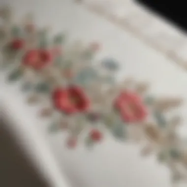 Close-up of intricate embroidery on white silk pillowcase