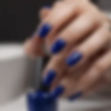 Close-up of a manicured hand showcasing the beauty of OPI Royal Blue nail polish