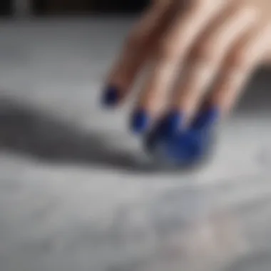 Elegant swirls of OPI Royal Blue nail polish on a marble surface