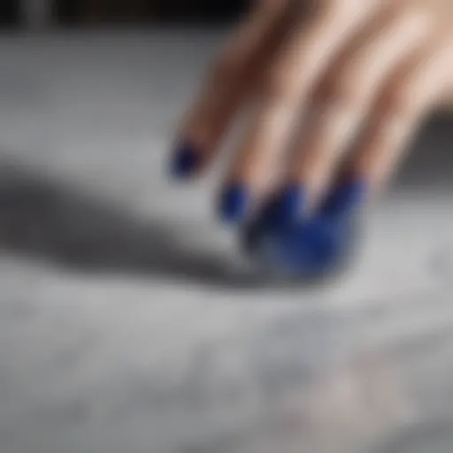 Elegant swirls of OPI Royal Blue nail polish on a marble surface