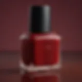 Close-up of Essie dark red nail polish bottle