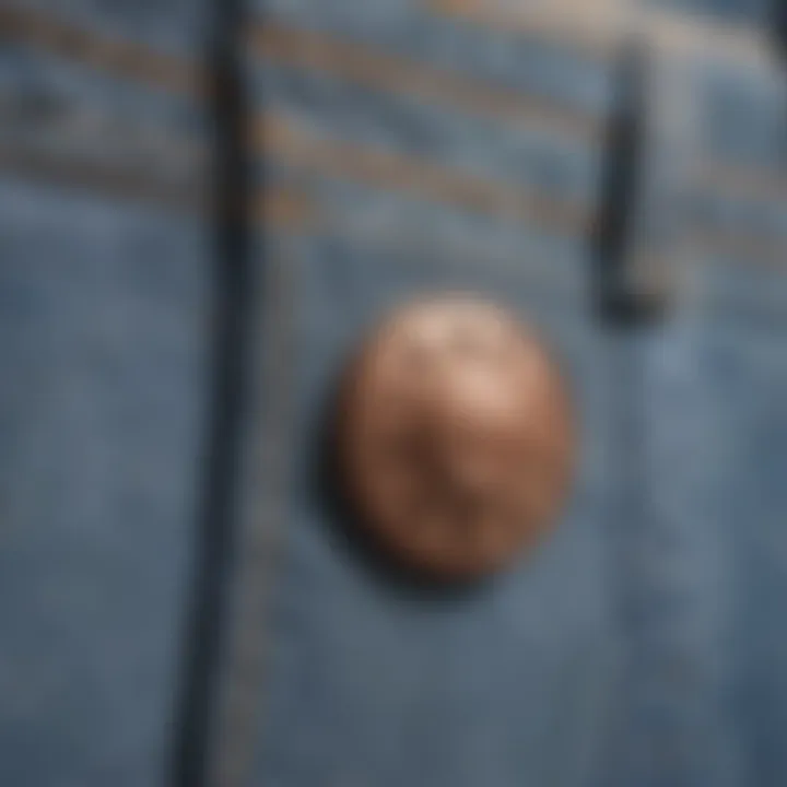 Detailed shot of Everlane light wash jeans rivets and buttons