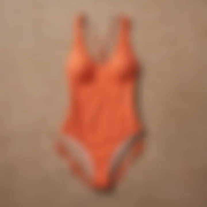 Sleek and minimalistic one-piece swimsuit in a vibrant coral hue