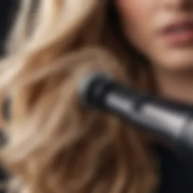Creating Soft Waves with Kristin Ess Tool Close-up of the curling iron barrel demonstrating wave creation