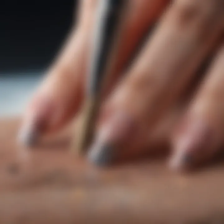 Close-up of a nail artist's intricate brush strokes on a nail