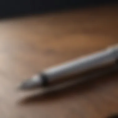 Sleek silver fountain pen on a polished wooden desk