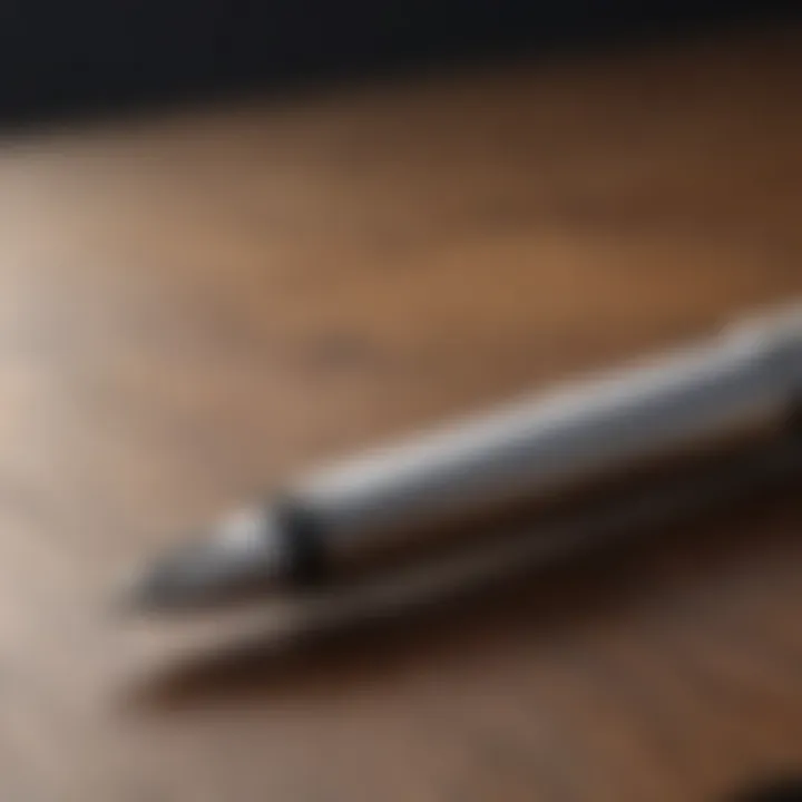 Sleek silver fountain pen on a polished wooden desk