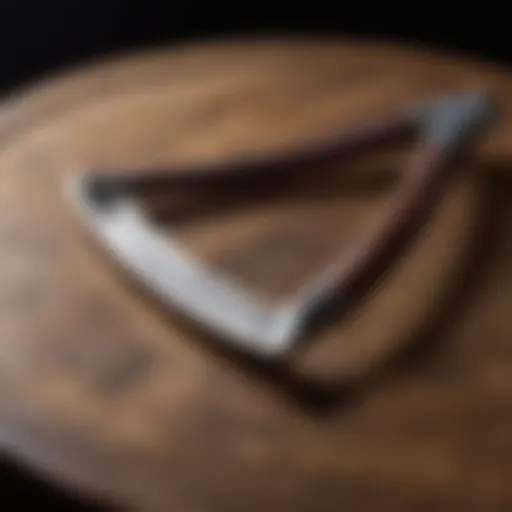 A vintage straight razor on a wooden surface