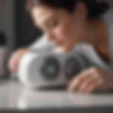 A user adjusting the settings on a white noise machine