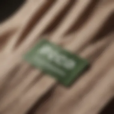 Close-up of eco-friendly fabric tags on stylish clothes, emphasizing sustainability.